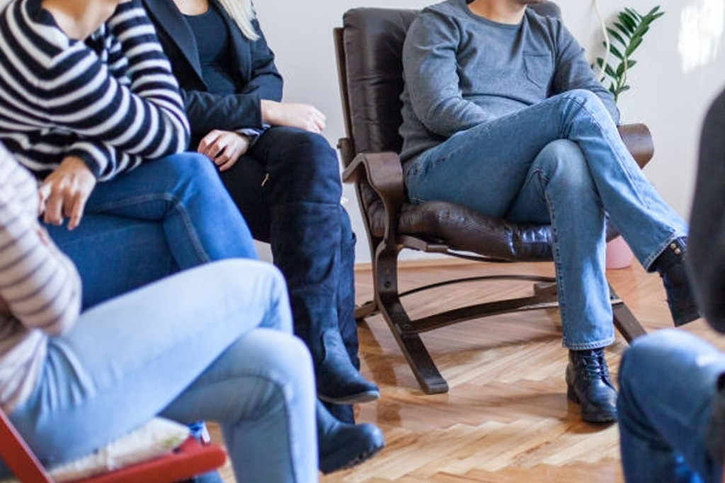 Group of people sat around in a meeting